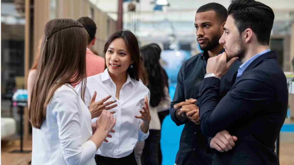 Business people standing up discussing business plans