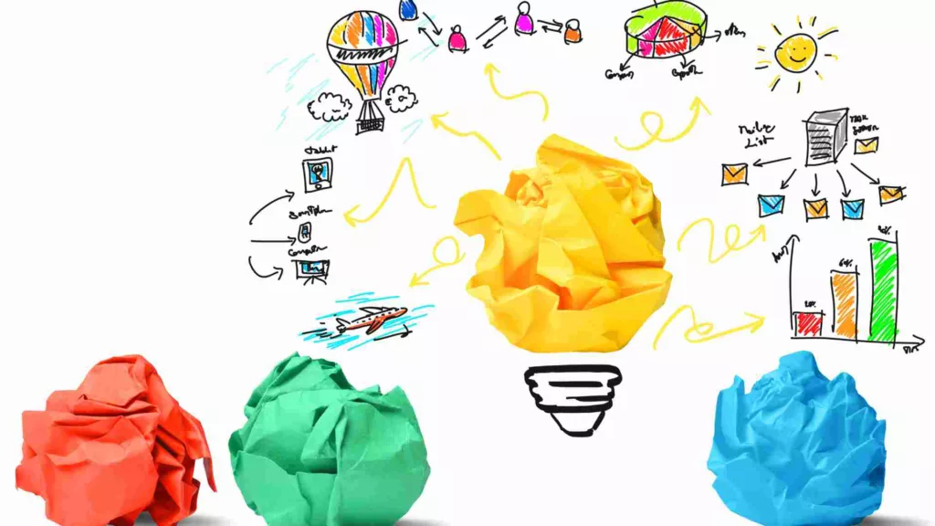 sticky notes scrunched up to become lightbulbs, with innovation illustrations on a whiteboard