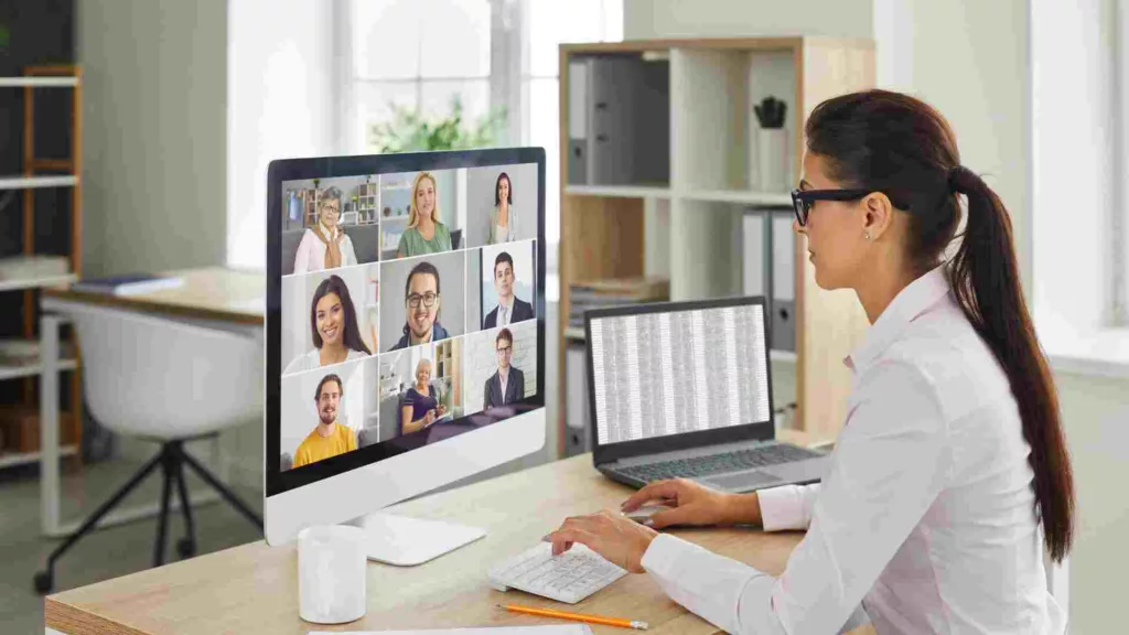 Virtual facilitator running a team meeting with delegates on screen