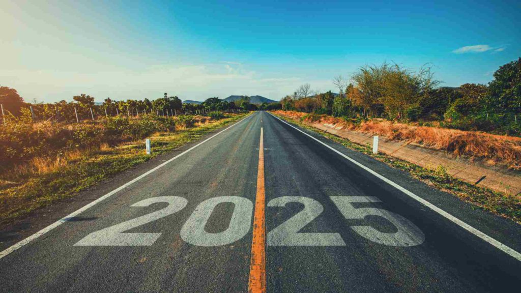 Photo of a road stretching into the distance, with 2025 painted on the orad surface in the foreground.