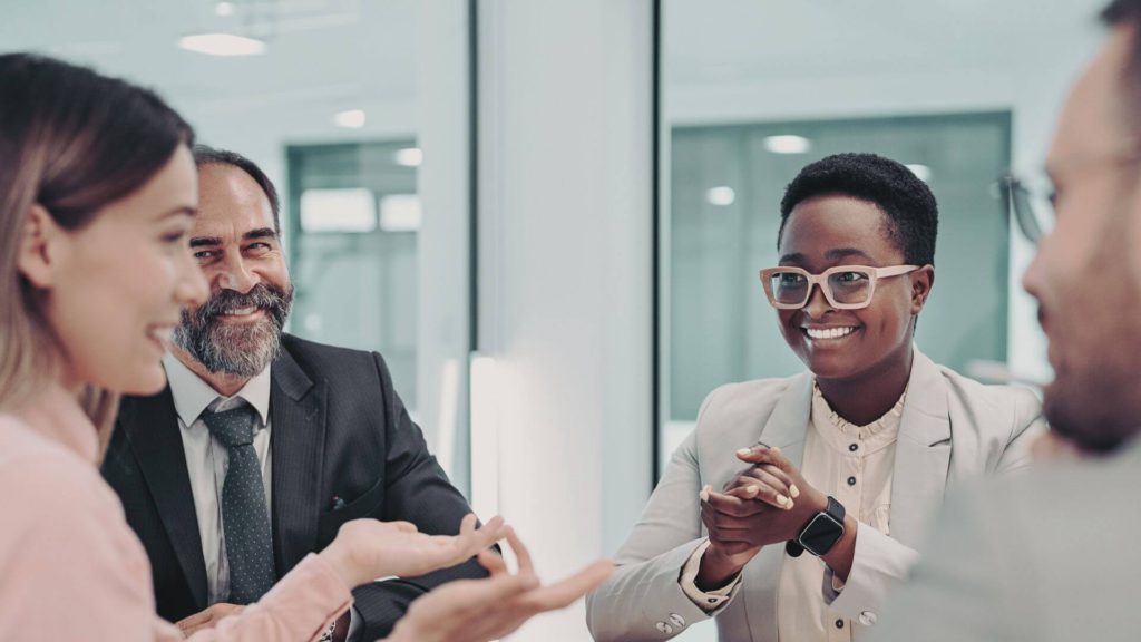 Business people smiling in a meeting